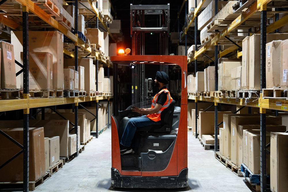 An SGK operator handling stock in the warehouse